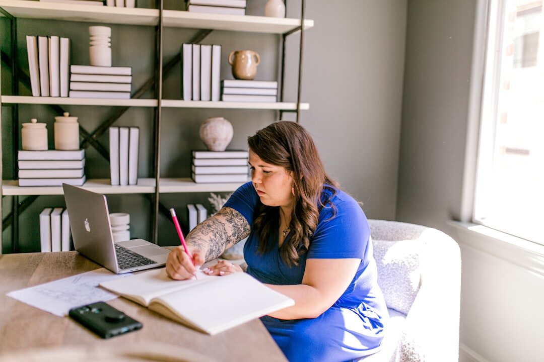 Author writing interview article at a desk